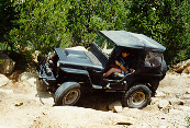 Paul driving up the second obstacle on Mad Dog